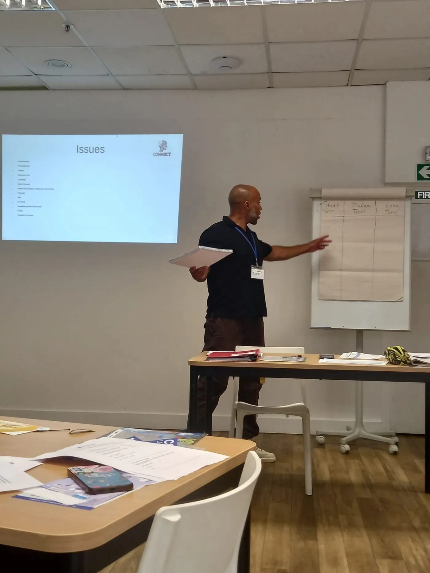 Taff Jones presenting a workshop beside a whiteboard